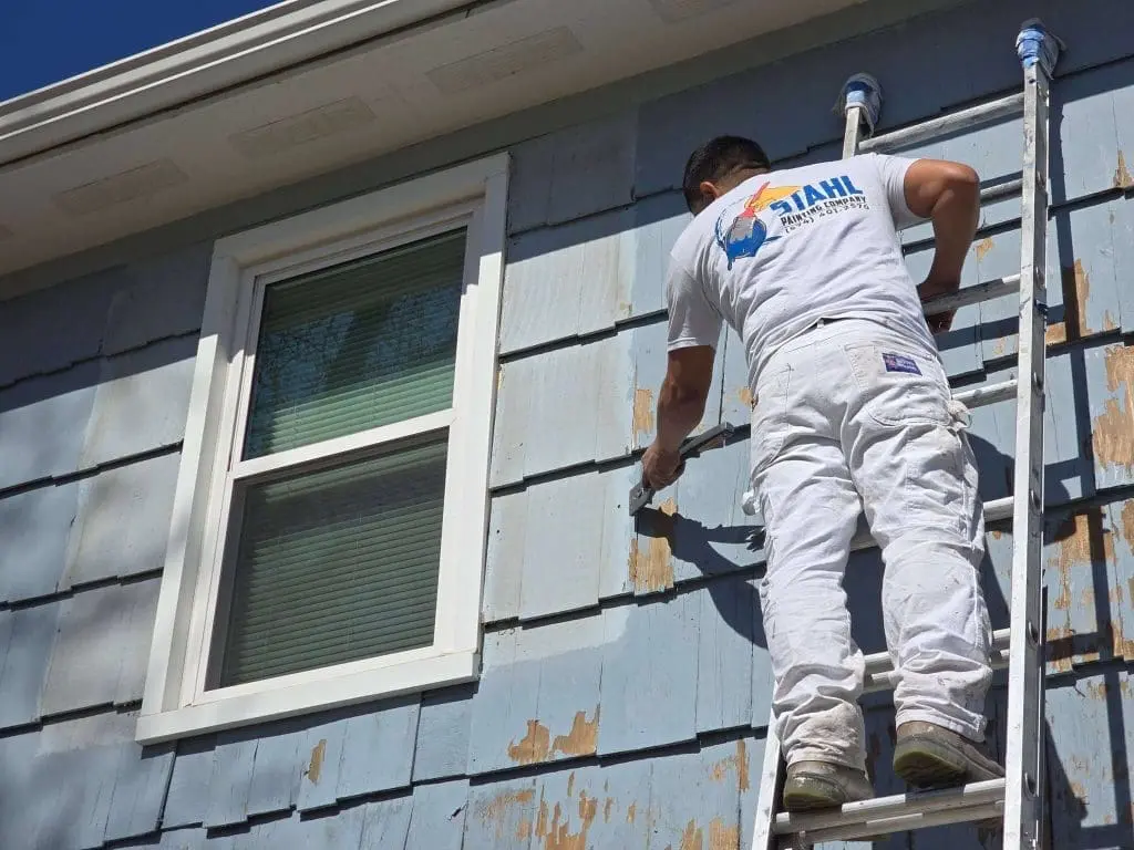 Stahl Painting Company’s expert crew performing residential exterior painting, utilizing spray application for a smooth, high-quality finish.
